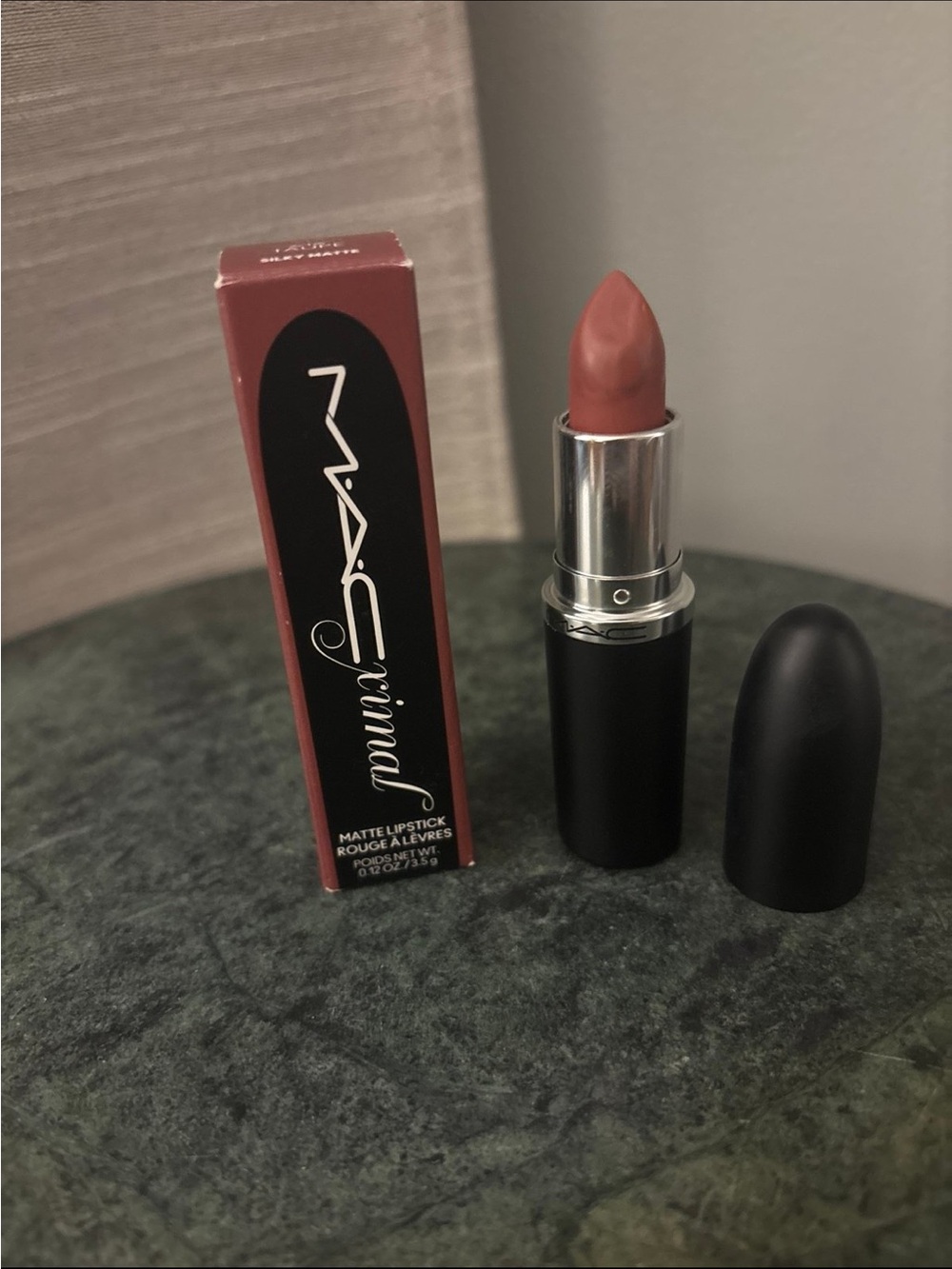 Mac lipstick in the shade 616 taupe silky mat